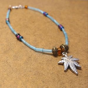 *5/25* Boho tribal bead bracelet with cannabis charm